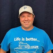 Image of Joe Melson against a blue backdrop.