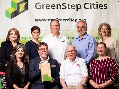 Photo of City of Red Wing staff, Council members, and Mayor accepting a GreenStep Cities award.