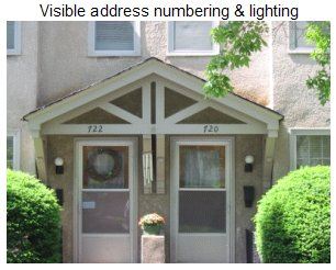 Crime free housing: duplex building with visible address numbers and lighting