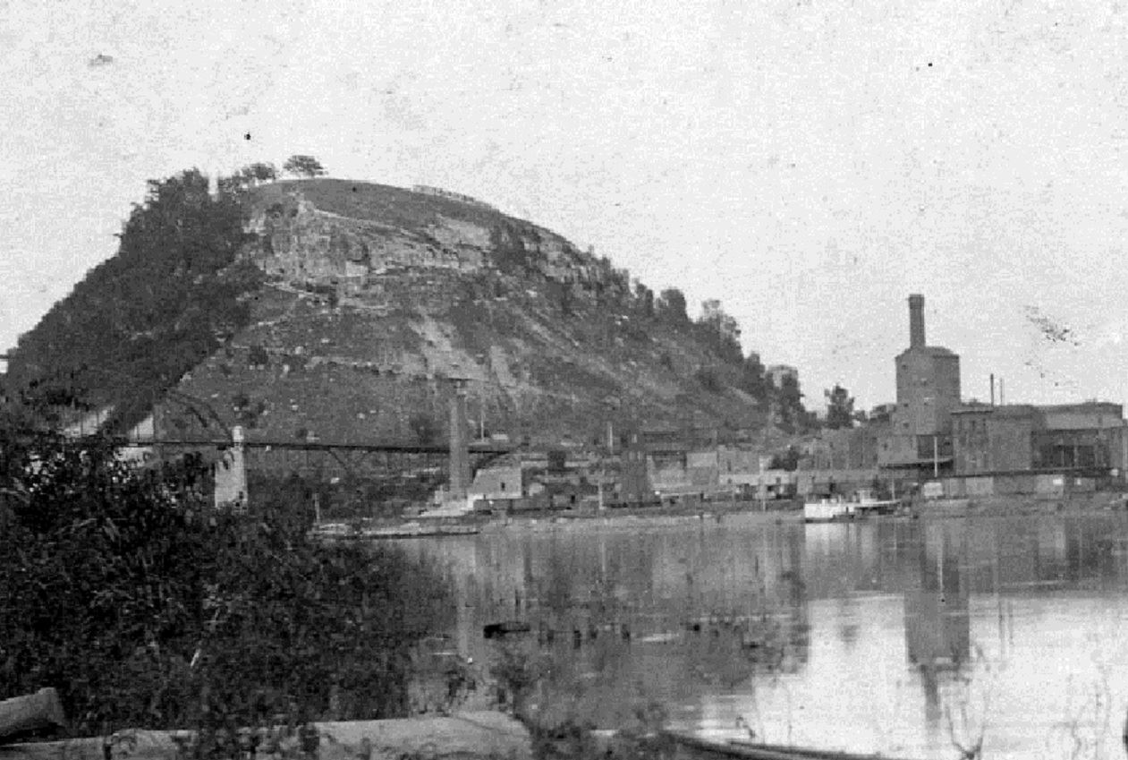 Historic view of Red Wing from Wisconsin side of Mississippi River, including He Mni Can-Barn Bluff