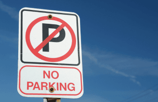 No parking sign with sky background