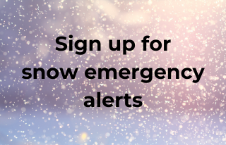Sign up for snow emergency alerts text on a snowy background