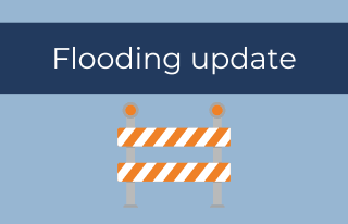 Flooding update, road barricade graphic