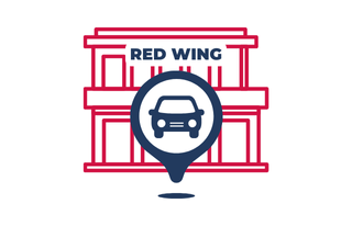Red Wing parking icon in front of building